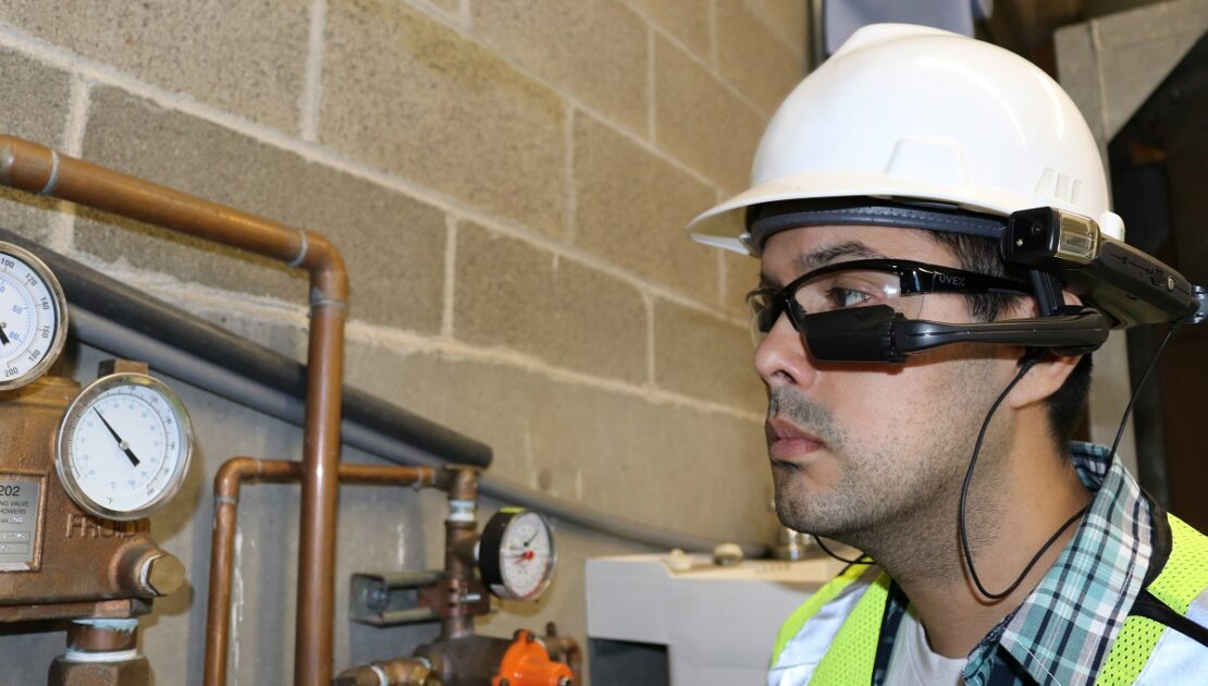 Worker Checks Guages